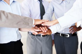 Personal injury attorneys join hands to show teamwork