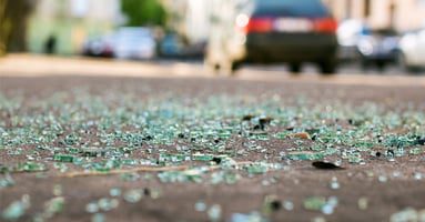 Broken glass on the road after a self driving car accident