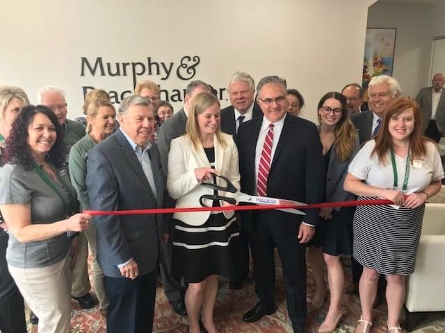 Attorneys ribbon cutting at West Bend opening