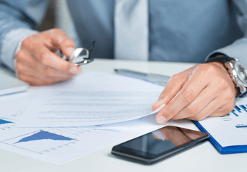 Car accident lawyer reviewing insurance premiums