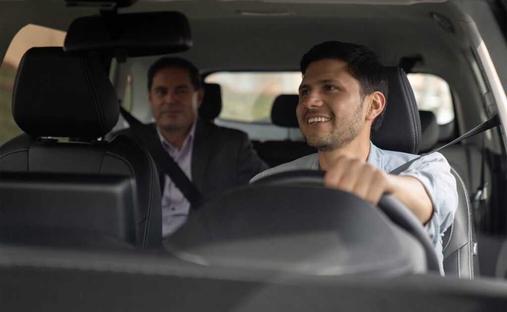 Rideshare driver talking to passenger